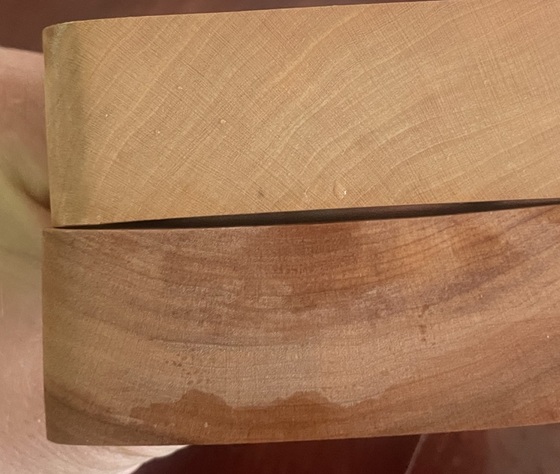 Two cherry Base blocks showing warp and moisture tide-line